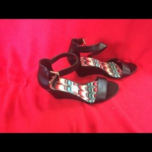 Black wedge heel sandals.